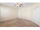 Carpeted bedroom featuring a ceiling fan and two closets at 406 Ravenshill Way, Deland, FL 32724