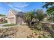 Single-story home with screened-in porch and mature landscaping at 406 Ravenshill Way, Deland, FL 32724