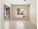 Bright living room with tiled floors, neutral walls, a window seat and natural light from multiple windows at 406 Ravenshill Way, Deland, FL 32724