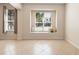 Bright living room with tiled floors, neutral walls, a window seat and natural light from multiple windows at 406 Ravenshill Way, Deland, FL 32724