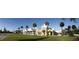 A charming shopping center in the community features many stores, palm trees, and parking at 406 Ravenshill Way, Deland, FL 32724
