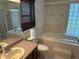 Bright bathroom features a garden tub, separate shower, neutral tiled floors and a large vanity mirror at 4164 New Marsh Rd, Deland, FL 32724