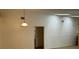 Bright interior shot featuring a hanging light fixture, with views into an adjoining room at 4164 New Marsh Rd, Deland, FL 32724