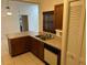 Traditional kitchen featuring wooden cabinets, neutral countertops and stainless steel appliances at 4164 New Marsh Rd, Deland, FL 32724