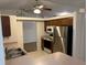 Kitchen with stainless steel refrigerator, tile floors, and ample cabinet space at 4164 New Marsh Rd, Deland, FL 32724