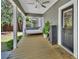 Cozy back porch with a daybed swing, perfect for relaxing outdoors at 427 E Church St, Deland, FL 32724
