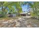 Wide backyard shot showing a shed, an outdoor gym, and a house at 427 E Church St, Deland, FL 32724