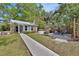 A charming backyard oasis with a patio, a hammock, and a small spa at 427 E Church St, Deland, FL 32724