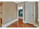 Bathroom entryway showing the hardwood floors, trim and doorway into the shower/toilet area at 427 E Church St, Deland, FL 32724