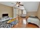 Spacious bedroom features hardwood floors, a ceiling fan, and neutral paint, perfect for comfort and relaxation at 427 E Church St, Deland, FL 32724