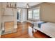 Spacious bedroom with hardwood floors, ample natural light and easy access to an adjacent bathroom at 427 E Church St, Deland, FL 32724
