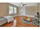 Comfortable bedroom features hardwood floors, natural light from a window, and a colorful beanbag chair at 427 E Church St, Deland, FL 32724