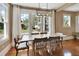 Bright dining room featuring wood floors, modern lighting and a large window with neighborhood views at 427 E Church St, Deland, FL 32724