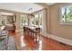 Bright dining room featuring hardwood floors, large windows, and modern light fixture at 427 E Church St, Deland, FL 32724