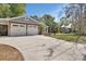 A spacious driveway leads up to a two-car garage and a charming house at 427 E Church St, Deland, FL 32724