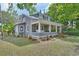 Traditional home boasting a large, welcoming wrap-around porch at 427 E Church St, Deland, FL 32724