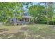 Inviting home featuring a spacious front yard and covered front porch at 427 E Church St, Deland, FL 32724