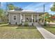 Charming house with a welcoming front porch, perfect for enjoying sunny days at 427 E Church St, Deland, FL 32724