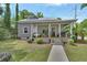 Cozy front porch with a hammock, string lights, and outdoor seating at 427 E Church St, Deland, FL 32724