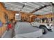 Spacious garage with a high ceiling and room for multiple vehicles, storage, and tools at 427 E Church St, Deland, FL 32724