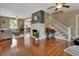 Open-concept living room with hardwood floors, a fireplace, and ample natural light at 427 E Church St, Deland, FL 32724