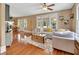 Spacious living room with hardwood floors, a large couch, and plenty of natural light at 427 E Church St, Deland, FL 32724