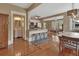 Open living space with a kitchen, dining area, living room, and powder room on display at 427 E Church St, Deland, FL 32724