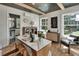 Stylish office space boasts dark wood ceilings, bright windows, and a modern, functional layout with a bathroom nearby at 427 E Church St, Deland, FL 32724