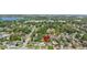 Aerial view of the property showcasing its location within a residential neighborhood with nearby lake at 4333 Arch St, Orlando, FL 32808