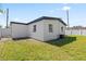 Exterior view of a house with a fenced backyard and a patch of grass at 4333 Arch St, Orlando, FL 32808