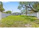 Expansive backyard featuring a well-maintained lawn and privacy fence, perfect for outdoor activities and relaxation at 4333 Arch St, Orlando, FL 32808
