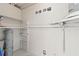 Unfinished basement storage area featuring concrete walls, shelving and concrete floors at 4333 Arch St, Orlando, FL 32808