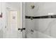 Elegant bathroom featuring marble walls, gold fixtures, and a luxurious bathtub at 4333 Arch St, Orlando, FL 32808