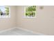 Bright bedroom with two windows offering natural light and views of the outdoors at 4333 Arch St, Orlando, FL 32808