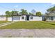 Charming home featuring a freshly painted exterior, green grass, and black trim at 4333 Arch St, Orlando, FL 32808