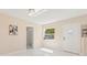 Bright living room with marble flooring and a view into the hall and bathroom at 4333 Arch St, Orlando, FL 32808