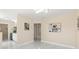 Open-concept living space with modern lighting, fresh paint, and sleek marble floors at 4333 Arch St, Orlando, FL 32808