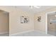 Cozy room showcases luxury flooring, neutral paint, decorative wall art and natural light at 4333 Arch St, Orlando, FL 32808