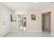 Living room with a stainless steel refrigerator, marble tile flooring and stylish neutral paint at 4333 Arch St, Orlando, FL 32808