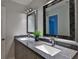 Well-lit bathroom featuring a granite vanity with double sinks at 437 Merrimac Dr, Port Orange, FL 32127