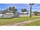 Exterior of home with large fenced-in yard, garage, and sidewalk at 437 Merrimac Dr, Port Orange, FL 32127