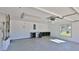 Spacious two car garage with window, built-in storage, and white walls at 437 Merrimac Dr, Port Orange, FL 32127