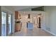 Bright kitchen featuring stainless steel appliances, an island, and tiled flooring throughout at 437 Merrimac Dr, Port Orange, FL 32127