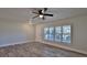 Bright living area with hardwood floors and neutral walls offers versatility and style at 437 Merrimac Dr, Port Orange, FL 32127