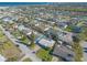 Beautiful aerial view of neighborhood homes, with a glimpse of the ocean in the distance at 44 Sunset Blvd, Ormond Beach, FL 32176