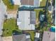 Bird's eye view of single story home; a cozy backyard, mature landscaping, and convenient shed at 44 Sunset Blvd, Ormond Beach, FL 32176