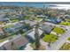 Aerial view of neighborhood featuring houses, green trees, and a body of water at 44 Sunset Blvd, Ormond Beach, FL 32176