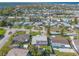 Aerial view of neighborhood showcasing houses, sidewalks, roads, and green trees at 44 Sunset Blvd, Ormond Beach, FL 32176