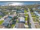 Aerial view of a quaint neighborhood surrounded by lush trees and a lake at 44 Sunset Blvd, Ormond Beach, FL 32176
