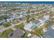 Aerial view of the neighborhood featuring tree lined streets, homes, and a beach in distance at 44 Sunset Blvd, Ormond Beach, FL 32176